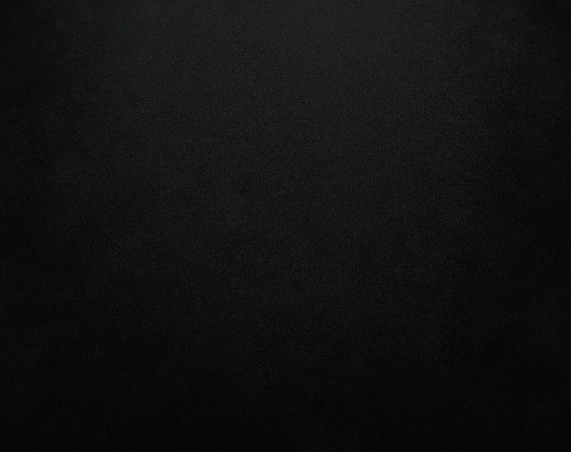 Dark textured background creating a subtle, elegant atmosphere